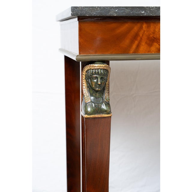 : Antique French Empire console table from the Consulate period of the early 19th century. The structure has a rigid...