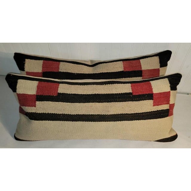 These hand Woven weaving saddle blanket stripped pillows are in fine condition and have suede backings.Down & feather fill.