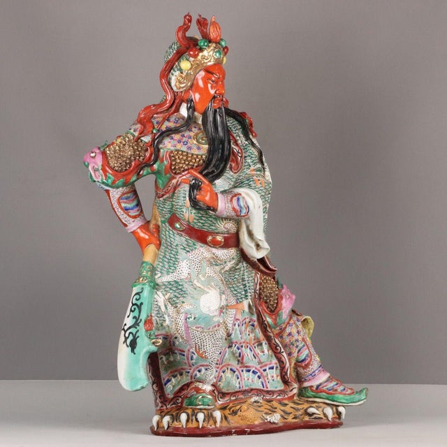 A monumental and elaborately decorated Chinese porcelain sculpture of Guan Gong (Lord Guan), the revered historical...