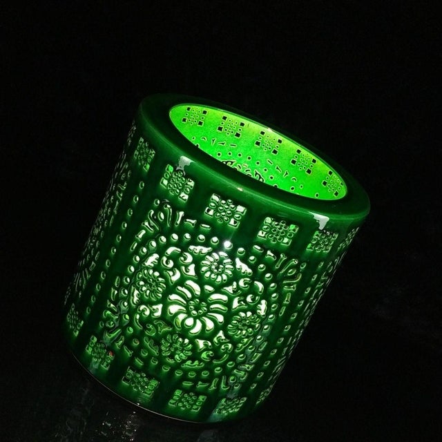 This is a striking, cylindrical porcelain brush pot (bitong) featuring a vibrant, emerald green glaze. The vessel is...