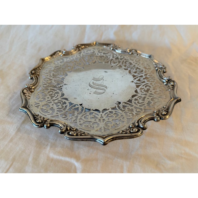 Antique sterling silver basket plate by Gorham, featuring an intricate decorative design. The plate has a relatively flat...
