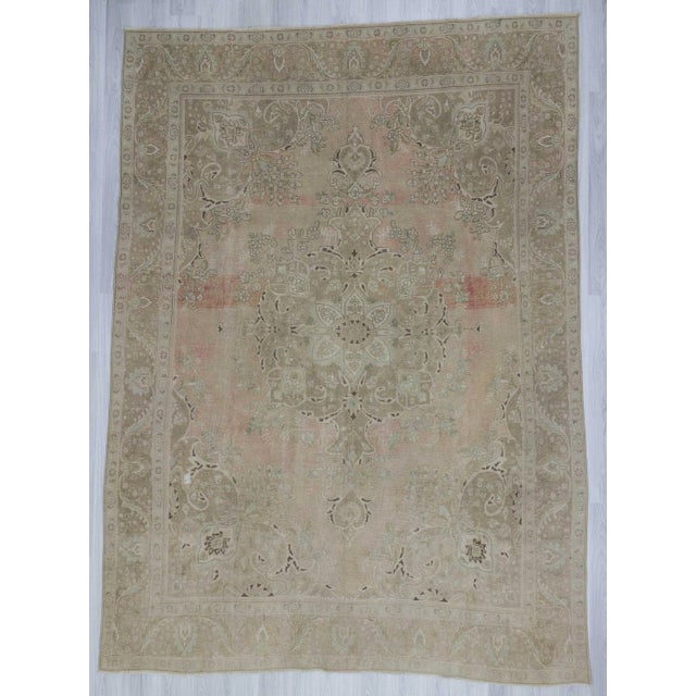 Handknotted vintage Persian rug. In good condition.