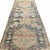 This antique runner embodies a beautifully restrained aesthetic, with a design that leans into simplicity and stylization....