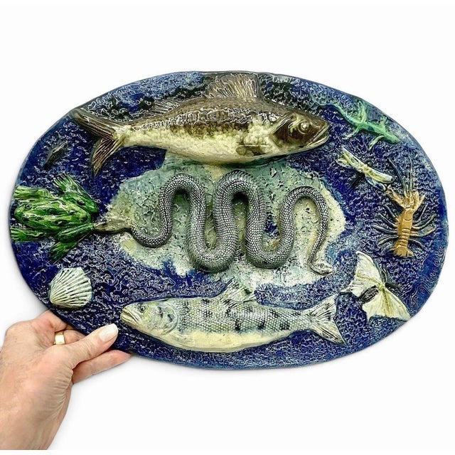 One François Maurice (1846-1896) large oval ceramic platter related in France, circa 1880. This lead-glazed earthenware...