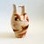 A large vintage Nemadji Pottery wedding vase with a dramatic organic pattern of orange and brown swirls on a light off-...