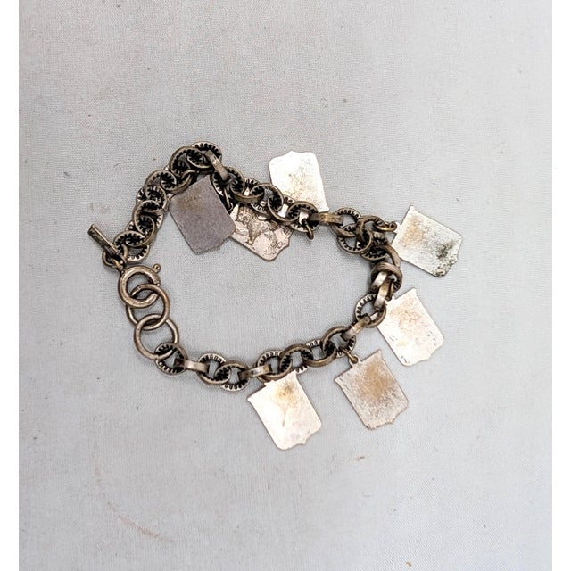 Metal Vintage 1930s Signed Monet Silvertone Coat of Arms Charm Bracelet For Sale - Image 7 of 8