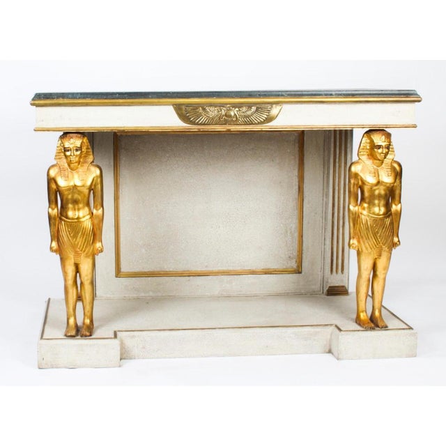 This is a beautiful vintage french empire style painted gilded and ormolu mounted console table, mid 20th century in date....