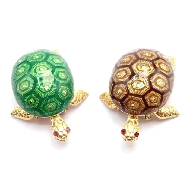 This vintage Boucheron France set of two turtle brooches is crafted in 18k yellow gold with richly detailed green and...