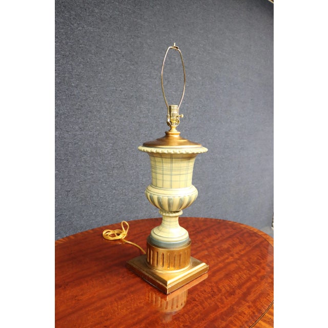 Porcelain paint decorated table lamp with gilt wood base. 25" from base to socket 33" total height