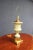 Porcelain paint decorated table lamp with gilt wood base. 25" from base to socket 33" total height