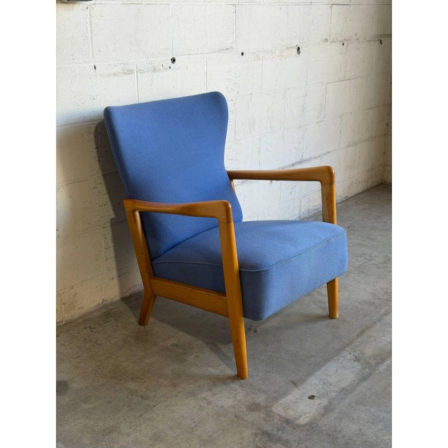 This highback lounge chair features contoured armrests and a sculpted high back. Its refined organic frame offers great...