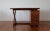 Administrative desk in solid teak, teak veneer and leather top. Rectangular top with an apron and thick veneer, affixed by...