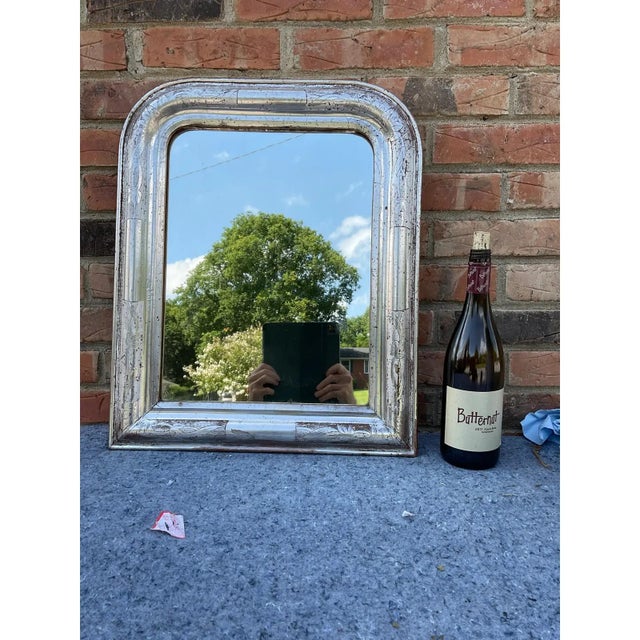 This 19th century Louis Philippe mirror is truly unique! Silver Louis Philippe style mirrors are not as common as gold,...