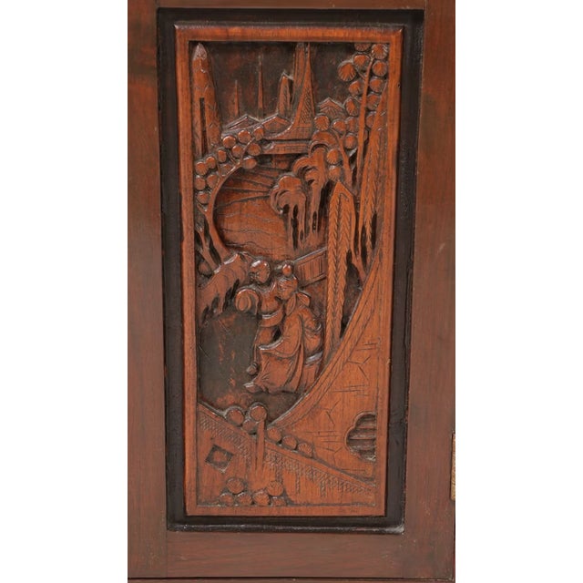 This lovely carved wood bar cabinet, circa 1960s, is a functional accent piece for any space where friends might gather to...