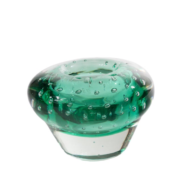 A mid-20th-century cased glass bowl in the Murano bullicante tradition, its rounded form rising from a solid clear foot to...