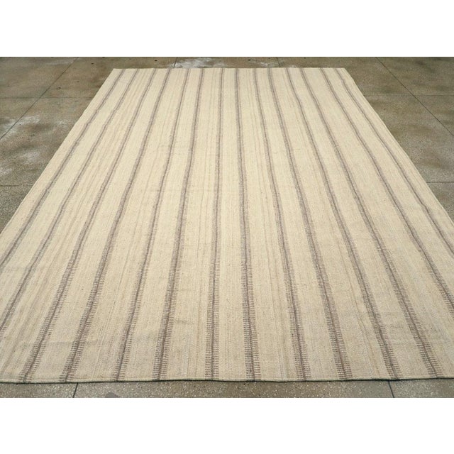 A vintage Turkish flatweave Kilim room size carpet handmade during the Mid-20th Century. Measures: 10' 2" x 13' 10".