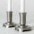 Pair of elegant pewter candlesticks from Just Andersen. Crisp lines, made for regular candles. This piece has an...