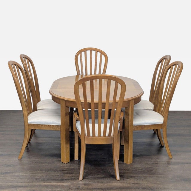 This Stanley Furniture dining set includes a spacious oval table and six chairs with comfortable cushioned seats. The...