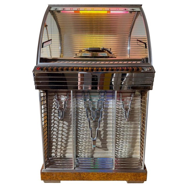 Bring the ultimate 1950s nostalgia into your home with this beautiful rock-ola 1448 jukebox, famously known as the...