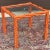 Vintage faux bois center table featuring a carved wooden frame resembling twisted twigs. Inset glass top 23.5”x23.5”