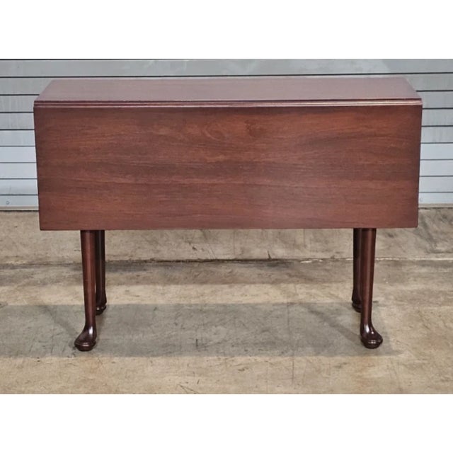 Store Item: Kittinger Williamsburg Mahogany Queen Anne Drop Leaf Table WA 1022 Description: Copied from an 18th century...
