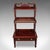 This is a vintage waterfall bookcase. An English, mahogany whatnot or open book shelf in Regency revival taste, dating to...