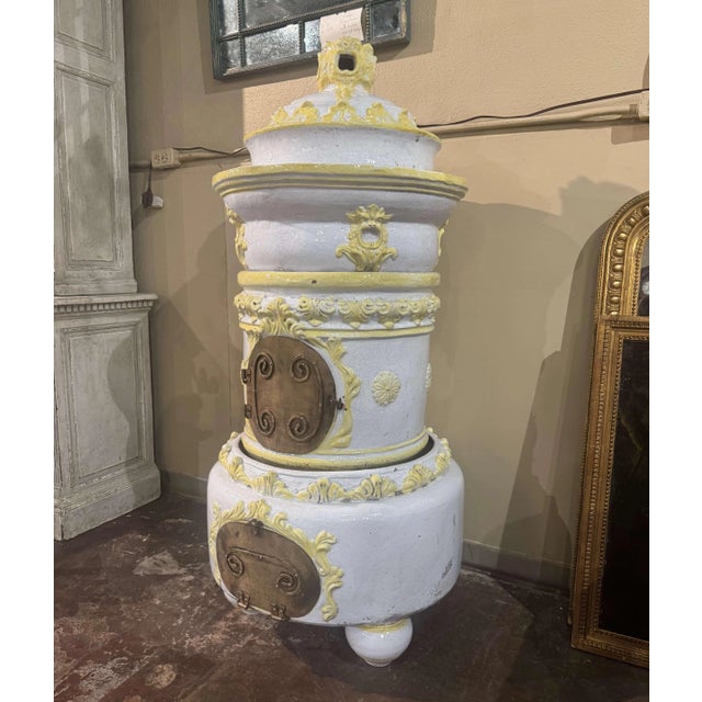 A remarkable example of 19th-century French craftsmanship, this antique wood-burning stove combines practical heating...