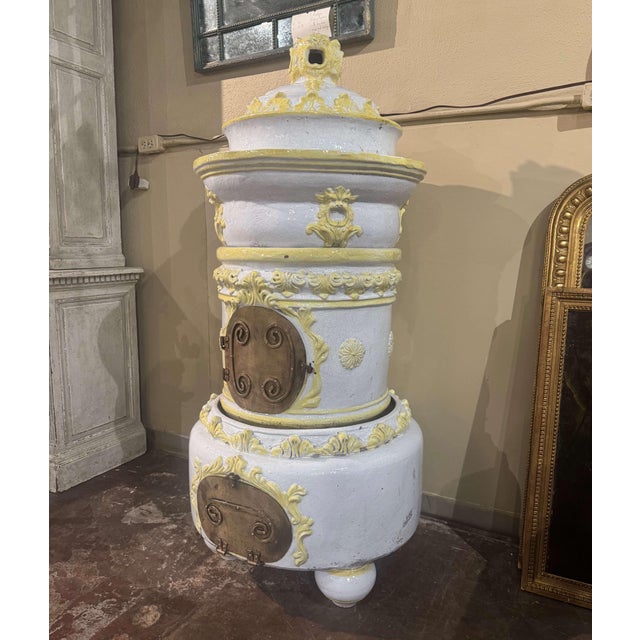 This tall, antique stove was created in Lyon, France, circa 1870. Sited on bun feet and built in four separate sections,...
