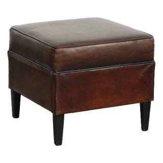 Dark Sheepskin Ottoman with Black Piping For Sale