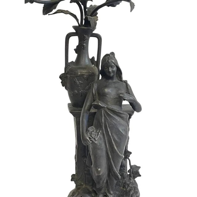 Antique antimony table lamp, female figure, early 20th century Elegant antimony lamp, female figure adorned with flowers....