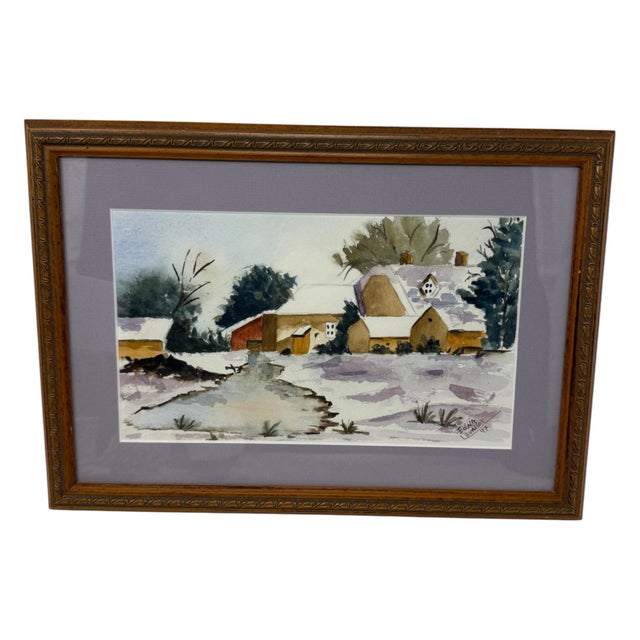 Charming original watercolor depicting a quiet rural homestead blanketed in snow, signed “Edna Evallos” and dated 1997....