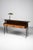 Vintage Italian dressing table with elegant shapes. This stunning 50’s design is made of wood and wood veneer with...
