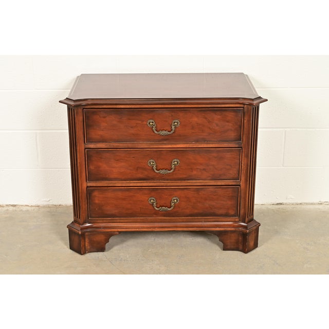 A gorgeous Georgian or Chippendale style three-drawer bedside chest or bachelor chest By Henredon USA, Circa Late 20th...