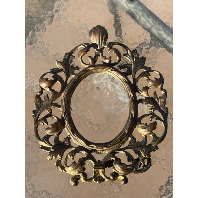 Victorian Brass Picture Frame with scrolls and a shell on top.