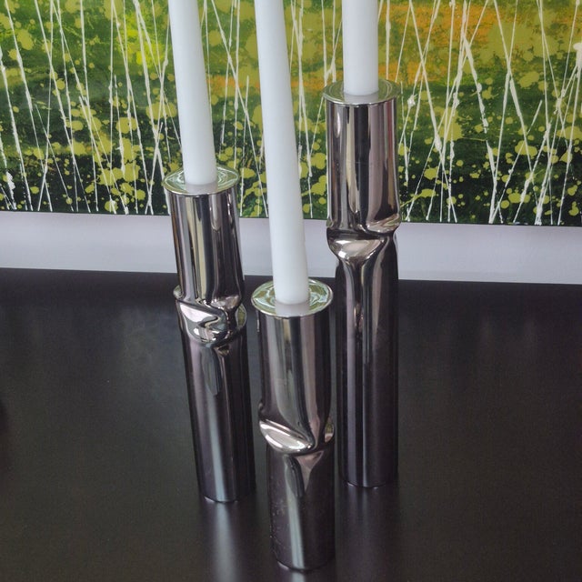 TRIO of metal vases, designer Giuliano Malimpensa. Model: Torsion. Composition: Silver-plated metal. Producer: Mesa Italy....