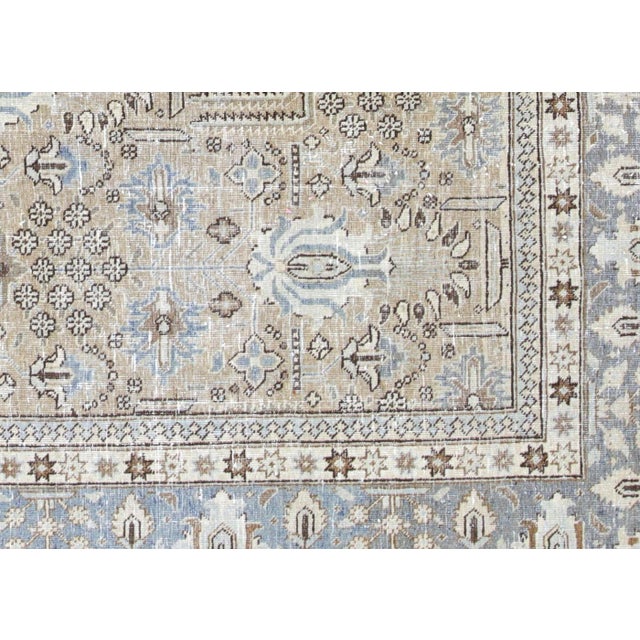 This Semi Antique Persian Tabriz Rug, measuring 7'3" x 9'9", is handwoven in Northern Iran’s Tabriz region and carefully...