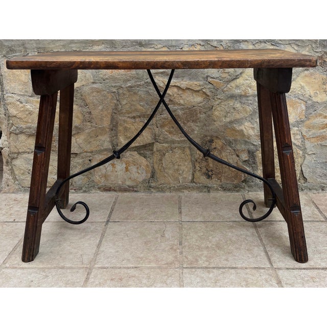 Beautiful early 20th-century provincial farmhouse table crafted in solid walnut with a warm, naturally aged patina. The...