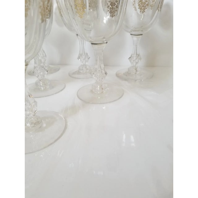 Twelve beautiful etched and gilded blown and pressed goblets Excellent condition. Four sided stems with blown bubble in...