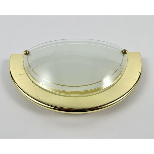 Vintage wall lamps from massive lighting, belgium, circa 1970s. the sconces are made of high quality glass with gilt metal...