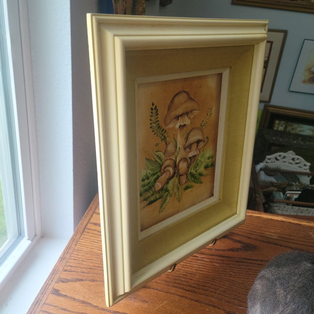 This product is a 1970s retro vintage mushroom yellow wood framed and matted print picture. The frame measuring 14 x 16...