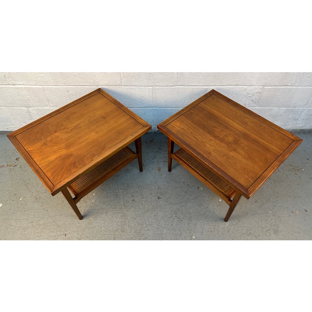 An iconic example of American Mid-Century Modern design, this pair of Drexel Declaration end tables was designed by...