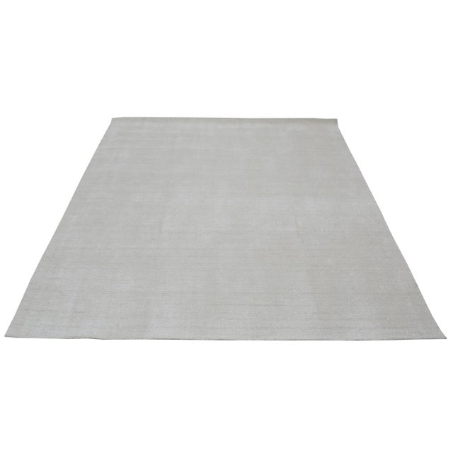 Hand-Loom with care using traditional rug making techniques, this wool/bamboo rug blends timeless craftsmanship with a...