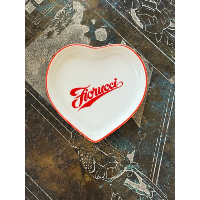 Porcelain catch all made for the iconic brand Fiorucci. Heart shaped with red detailing. Made in Italy. Excellent vintage...
