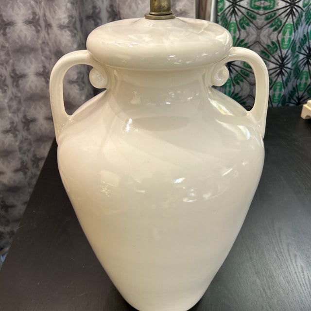 White ceramic table amphora style lamp with loop handles. It resembles a decorative vase from the Byzantine era. Wiring...