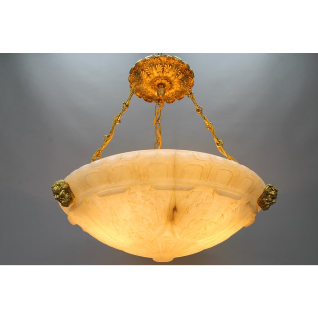 Large French Neoclassical style alabaster and bronze pendant light fixture, ca. 1890. An impressive late 19th-century...