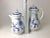 Pair Meissen blue onion coffee pots 9" and 11" tall. Age appropriate wear with very minor flea bites to the finial flowers.
