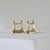 Pair of Neoclassical Andirons in Patinated Brass. Europe, late 19th century. A wonderful pair of neoclassical andirons or...