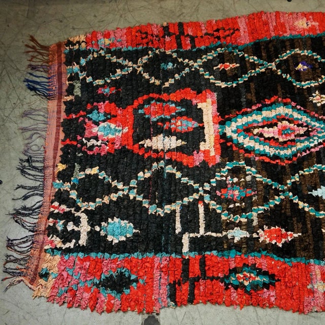 Charming Multicoloured Vintage Berber Moroccan Boucherouite rug with boho chic tribal style. This hand-knotted wool...