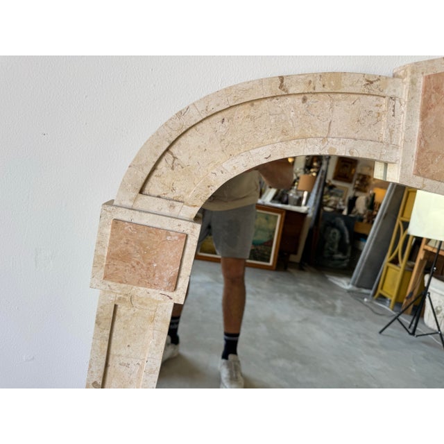 Elegant and architecturally inspired, this vintage wall mirror is crafted in the style of Maitland-Smith and showcases a...