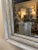 Antique mirror placed in a grey antique frame. Great for a entry or powder room. From France.